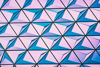 A vibrant triangular pattern with shades of pink and blue for modern backgrounds. HD wallpaper