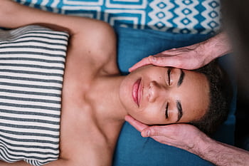 A peaceful spa facial massage promoting relaxation and skincare wellness. HD wallpaper