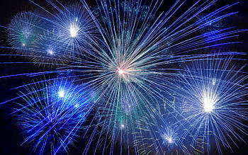 Stunning fireworks with vibrant colors exploding in the night sky, perfect for celebrations. HD wallpaper