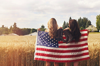 All American Cowgirls, blonde, brunette, house, flag, cowgirls, American Flag, field, wheat, trees, boots, home HD wallpaper