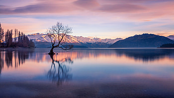 Landscape View Of Snow Capped Rock Mountains Trees Under White Clouds Blue Sky Reflection On Lake Nature HD wallpaper