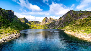 Beautiful landscape of a fjord surrounded by mountains and clear water in Moskenes, Norway. HD wallpaper
