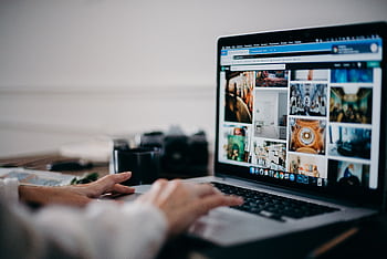 Close-up of hands using laptop for searching and browsing digital gallery. HD wallpaper