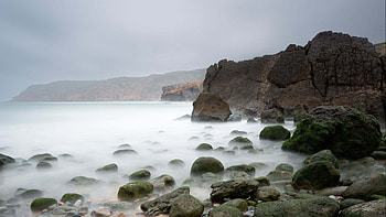 Pebbles Stones Rocks Ocean Water With Fog Under Blue Sky Nature HD wallpaper