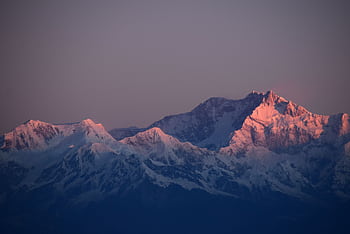 Breathtaking sunset view of snow-capped mountains in Nepal, perfect for scenic backgrounds. HD wallpaper