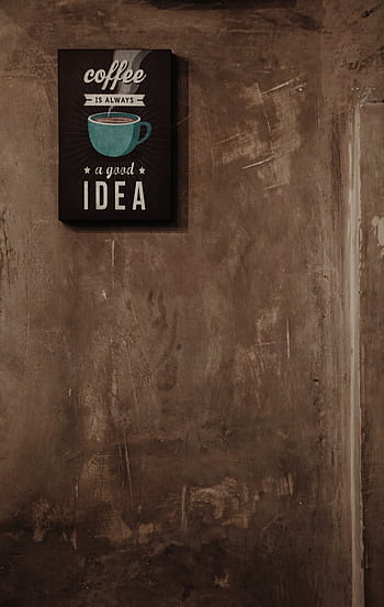 Industrial concrete wall with coffee-themed decor in Karawaci coffee shop. HD phone wallpaper