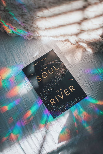 Artistic of a book with rainbow refractions creating a vibrant and creative ambiance. HD phone wallpaper