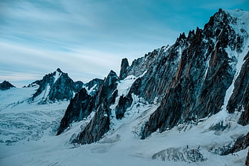 Explore the stunning snow-covered peaks of Mont Blanc Massif, capturing the essence of winter's serene beauty in Haute-Savoie, France. HD wallpaper