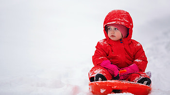 Cute Child Toddler Is Sitting On Snow In White Background Wearing Red Woolen Knitted Dress And Cap Cute HD wallpaper