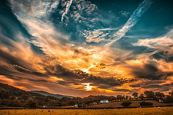 Breathtaking sunset in Conwy, Wales with colorful skies over a rural landscape. Perfect for nature and travel themes. HD wallpaper