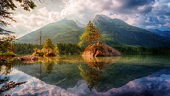 Beautiful alpine lake scene with mountain reflections in Germany during daylight. HD wallpaper