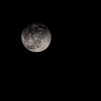 Captivating full moon against a dark night sky, exuding serenity and mystery. HD phone wallpaper