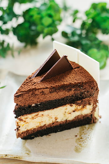 Indulge in a rich chocolate mousse cake slice, perfect for dessert lovers. HD phone wallpaper