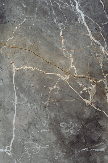 Close-up of a grey marble surface showcasing intricate natural veining patterns. HD phone wallpaper