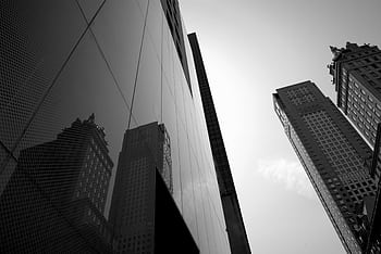 Low angle view of modern skyscrapers in a cityscape with reflections. HD wallpaper