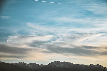 Beautiful mountain landscape in Tirol, Austria with stunning cloud formations at sunset. HD wallpaper