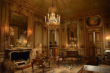 Elegant and opulent palace interior with chandeliers and lavish decor. HD wallpaper