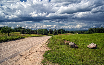 Road in Latvia, clouds, Latvia, grass, road, rocks HD wallpaper