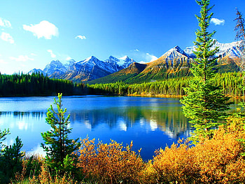 Two seasons, winter, snowy, mountain, lake, summer, season, reflection, mirrored, clouds, trees, nature, sky, peak, sun HD wallpaper