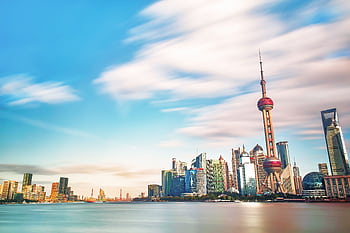 Stunning view of Shanghai's skyline featuring the iconic Oriental Pearl Tower and modern skyscrapers. HD wallpaper