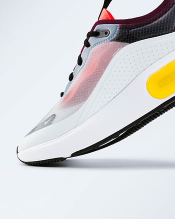 Stylish sneaker showcasing vibrant colors on a clean white backdrop. HD phone wallpaper