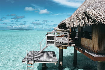 Scenic overwater bungalow in Vaitāpē, French Polynesia. Perfect tropical escape. HD wallpaper