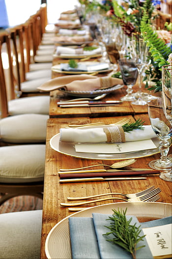 Close-up of a beautifully arranged table setting with flowers and cutlery, perfect for weddings or fine dining. HD phone wallpaper
