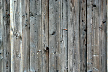 Close-up of a rustic wooden plank wall with weathered texture and natural grain. HD wallpaper