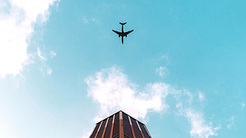 Plane Flying Over Building , planes, building HD wallpaper