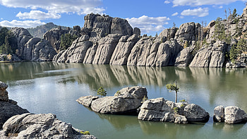 Rocks Stones On Lake Landscape View Of Mountain Peak Under White Clouds Blue Sky During Daytime Reflection On Water Nature HD wallpaper