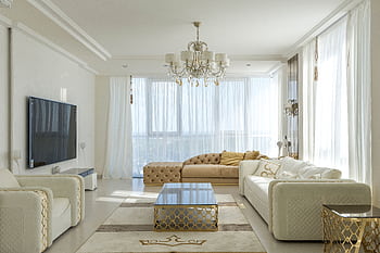 Luxurious modern living room featuring cozy sofas, chandelier, and large windows. HD wallpaper