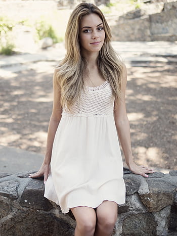 Portrait of a young woman in a white dress sitting outdoors on a sunny day. HD phone wallpaper