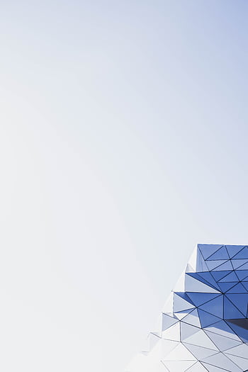 Abstract geometric architecture with clear sky and copy space, perfect for modern design backgrounds. HD phone wallpaper