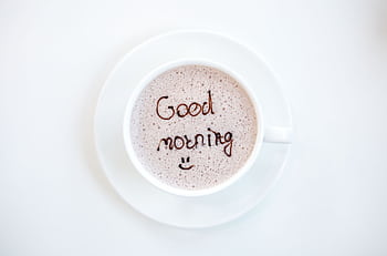 A cheerful hot coffee with 'Good Morning' written on top, perfect for starting the day. HD wallpaper