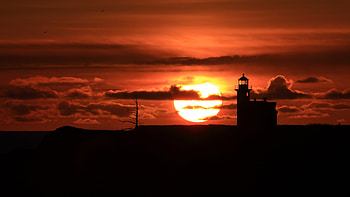 Lighthouse sunset, Spectacular views, Vibrant colors, Breathtaking scenery HD wallpaper