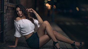 Beautiful Girl Model Is Sitting In Blur Lights Bokeh Background Wearing White Top And Black Shorts Girls HD wallpaper