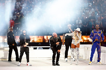 Rap at the Super Bowl halftime show, Star-studded performances, Electrifying stage presence, Unforgettable musical moments HD wallpaper