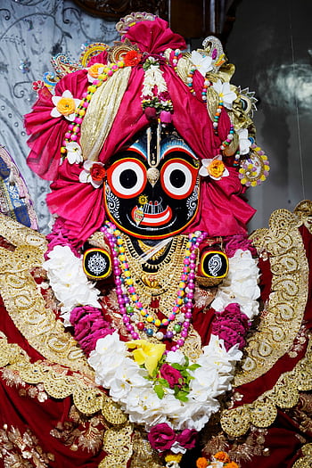 Colorful and intricate statue of Lord Jagannath adorned with flowers at ISKCON Dhaka Swamibag Temple, Bangladesh. HD phone wallpaper