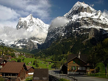 Wetterhorn and Shreckhorn from Grindelwald, grass, sky, mountains, town HD wallpaper