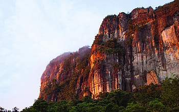 Early morning glow in the Madagascan rain forest, sky, mountains, cliff, rocks HD wallpaper