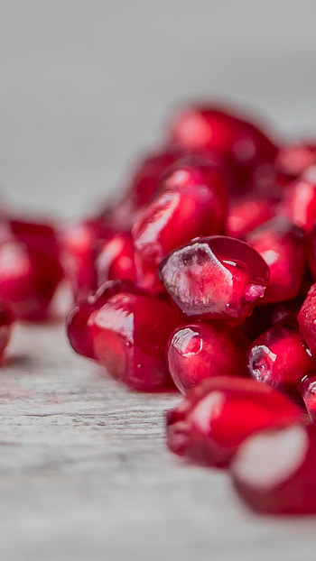 Pomegranate seeds, Vibrant background, Fresh produce, Nutritional benefits HD phone wallpaper