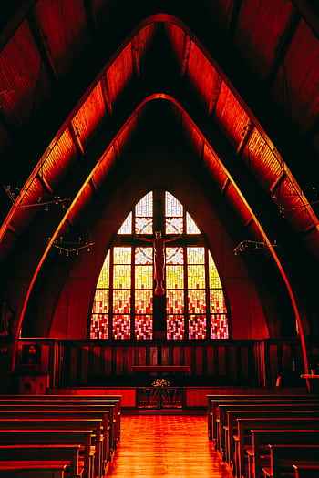 A stunning church interior with vibrant stained glass windows and wooden pews. HD phone wallpaper
