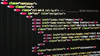 Close-up of vibrant HTML code displayed on a computer screen, showcasing web development and programming. HD wallpaper