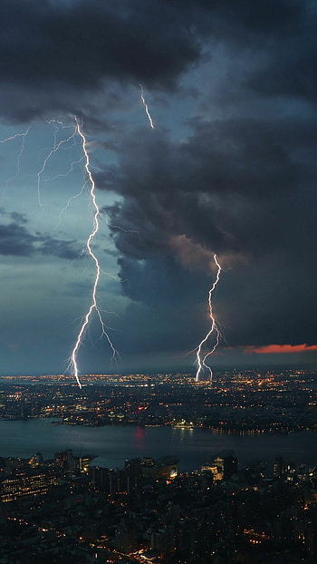 Thunderstorm drama, Cityscape spectacle, Rainy skyline, Overcast ambiance HD phone wallpaper
