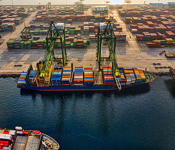 Aerial shot of colorful shipping containers at North Jakarta's bustling port, Indonesia. HD wallpaper