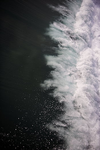 graph of a powerful ocean wave crashing, creating a dynamic splash and water droplets. HD phone wallpaper