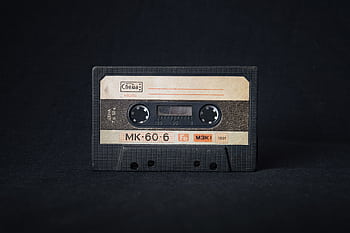 Close-up of a classic 1991 cassette tape symbolizing music nostalgia and retro style. HD wallpaper