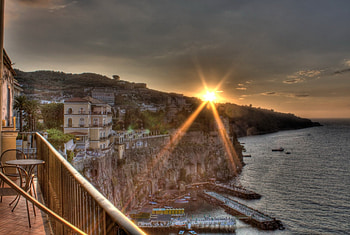 gorgeous sunset over a seaside town r, sea, shore, town, porch, r, cliff, sunset HD wallpaper