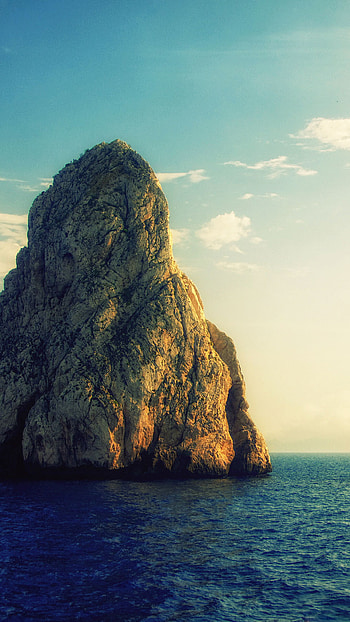 Majestic rock island, Dramatic landscapes, Nature's grandeur, Remote escape HD phone wallpaper