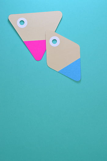 Two colorful paper tags with holes on a teal background. Ideal for design and marketing concepts. HD phone wallpaper